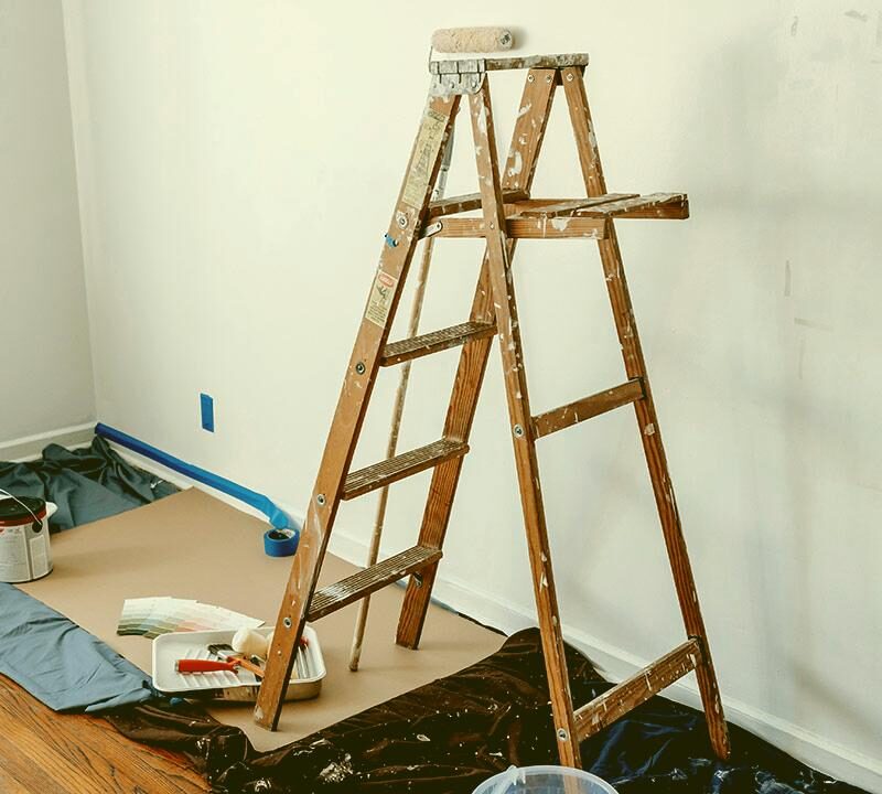 Ladder and painting materials